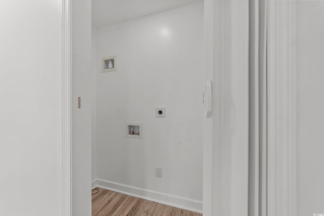 laundry area with laundry area, washer hookup, light wood-style floors, and hookup for an electric dryer