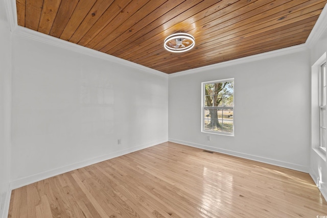 spare room with crown molding, visible vents, light wood-type flooring, wooden ceiling, and baseboards