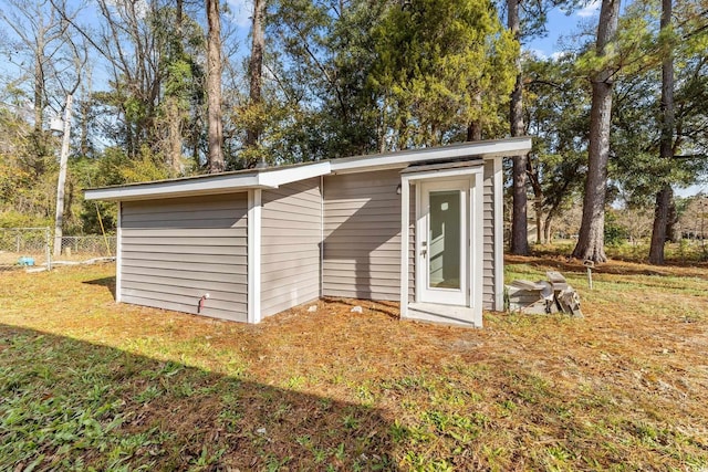 view of shed with fence