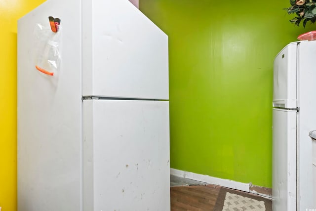 815 Rogers Dr, Myrtle Beach, SC 29577 - kitchen with freestanding refrigerator, wood finished floors, and baseboards