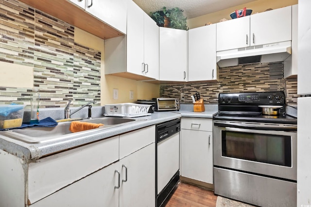 kitchen with sink, white dishwasher, white cabinets, stainless steel electric range oven, and decorative backsplash