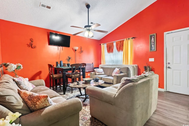 815 Rogers Dr, Myrtle Beach, SC 29577 - living area featuring vaulted ceiling, ceiling fan, a textured ceiling, and wood finished floors
