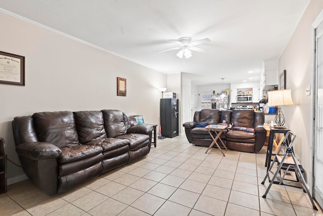 tiled living room featuring ceiling fan and crown molding