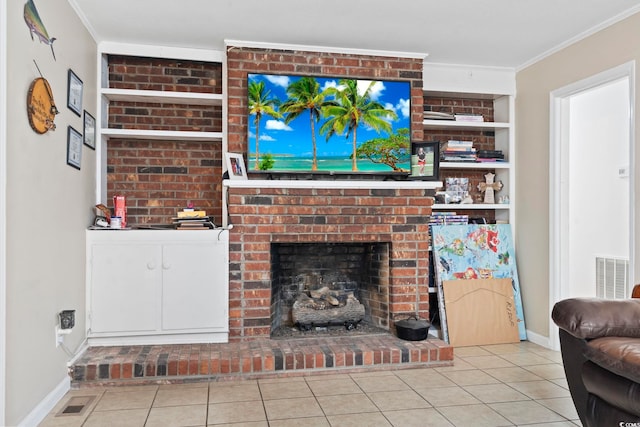 living room featuring a brick fireplace, built in shelves, light tile patterned floors, and ornamental molding