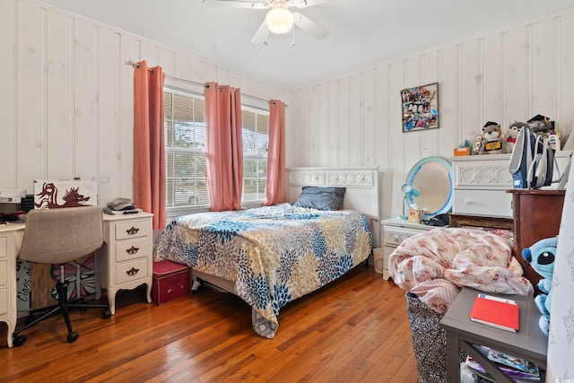 bedroom with ceiling fan and wood-type flooring