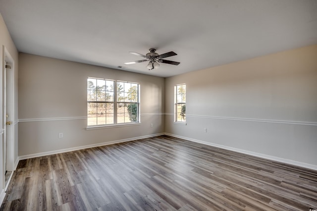 spare room with hardwood / wood-style flooring and ceiling fan