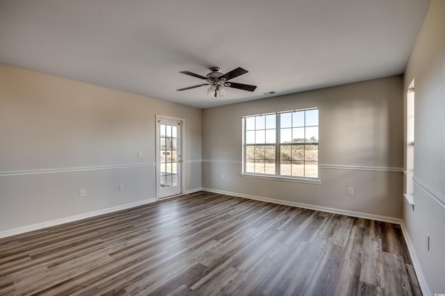 spare room featuring ceiling fan and hardwood / wood-style flooring