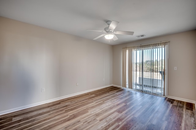 empty room featuring ceiling fan and hardwood / wood-style floors