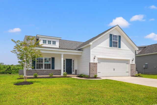 332 Hayloft Cir, Conway, SC 29526 - view of front facade with brick siding, concrete driveway, a front yard, and board and batten siding