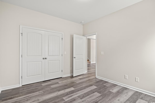 332 Hayloft Cir, Conway, SC 29526 - unfurnished bedroom featuring wood finished floors and a closet