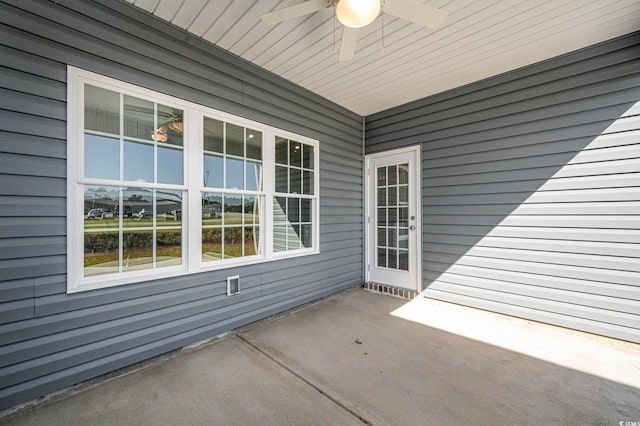 view of patio featuring ceiling fan