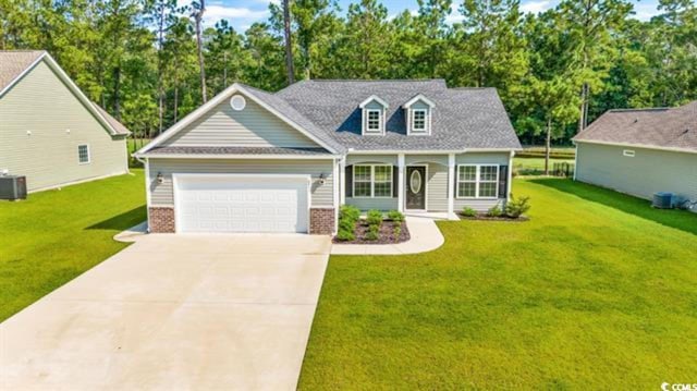 view of front facade featuring central AC, a garage, and a front yard