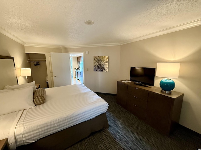 bedroom with ornamental molding and a textured ceiling