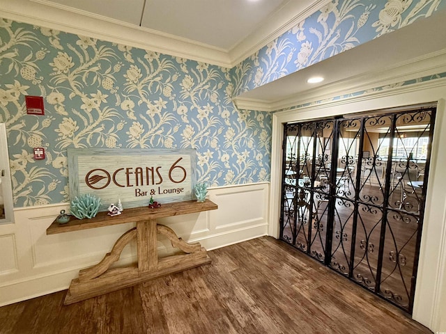 interior space with crown molding and hardwood / wood-style floors