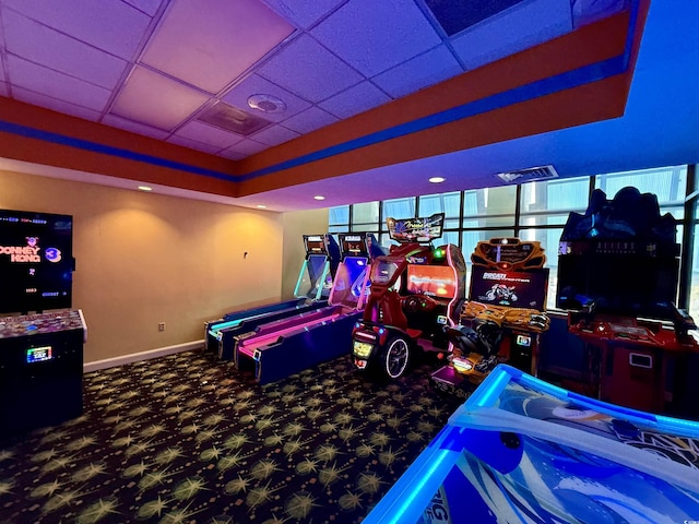 playroom featuring carpet flooring and a paneled ceiling