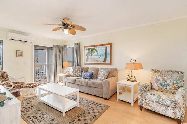 living room with hardwood / wood-style flooring, ceiling fan, ornamental molding, and a wall unit AC