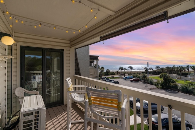 view of balcony at dusk