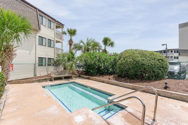 view of swimming pool with a patio area