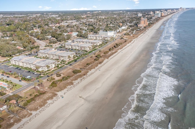 bird's eye view featuring a water view and a view of the beach