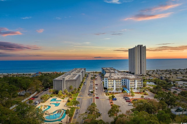 aerial view at dusk with a water view