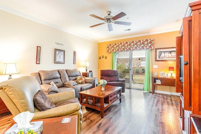 living room with ceiling fan, dark hardwood / wood-style flooring, and ornamental molding