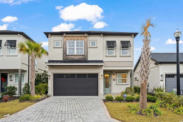 view of front of property featuring a garage