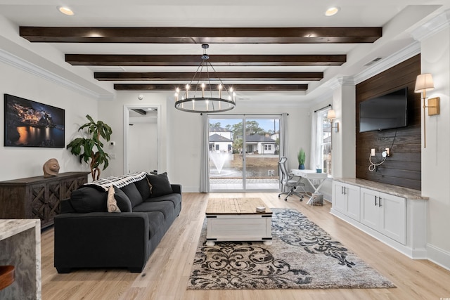 living room with beamed ceiling, light hardwood / wood-style flooring, and a notable chandelier