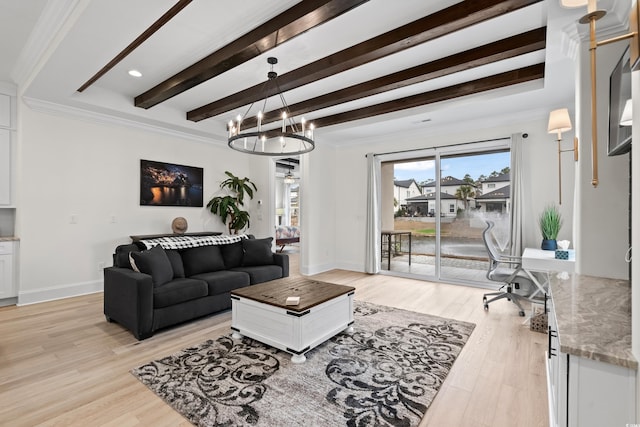 living room featuring crown molding, light wood-type flooring, and an inviting chandelier