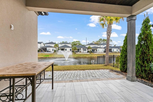 view of patio featuring a water view