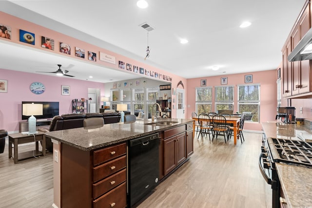 kitchen featuring ceiling fan, dishwasher, light hardwood / wood-style floors, and sink