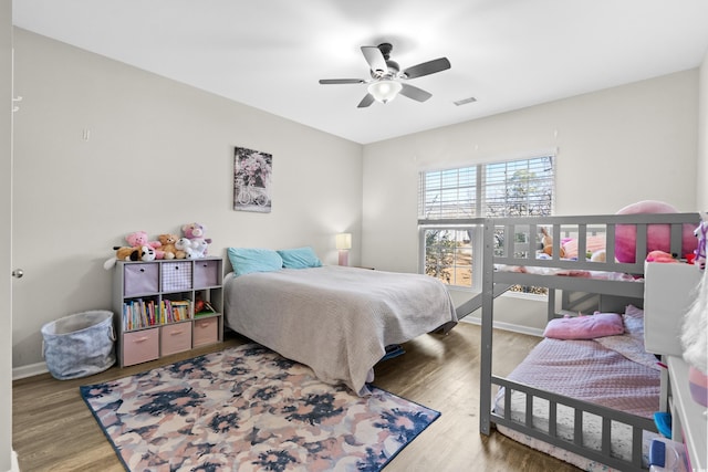 bedroom with ceiling fan and hardwood / wood-style floors