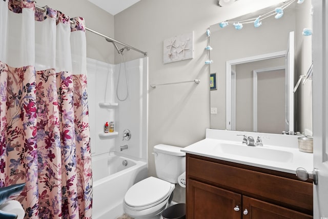 full bathroom with vanity, toilet, and shower / tub combo with curtain