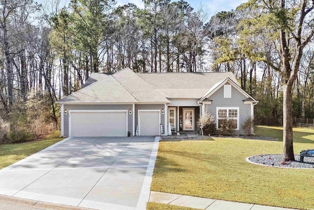 view of front of house featuring a garage and a front lawn