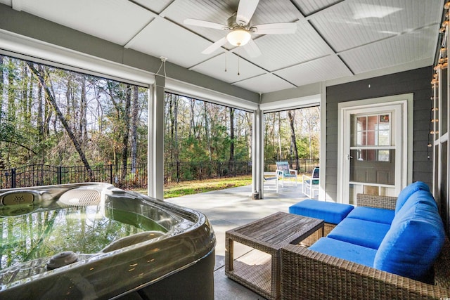 sunroom / solarium featuring ceiling fan