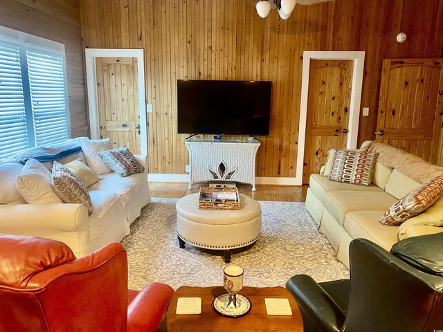 bedroom with hardwood / wood-style flooring, lofted ceiling, and wood walls