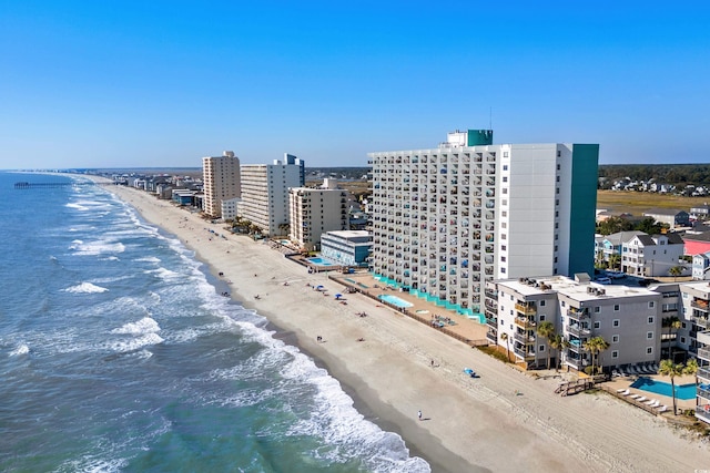 bird's eye view featuring a city view, a beach view, and a water view