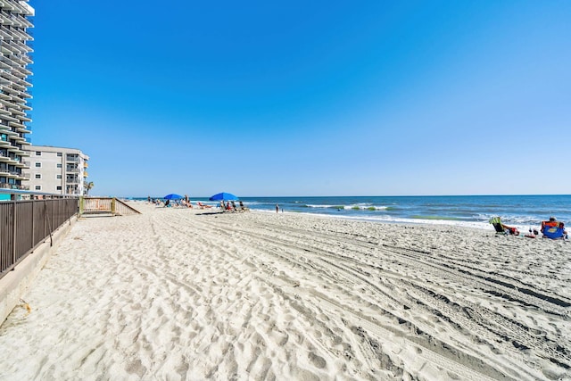 property view of water featuring a beach view