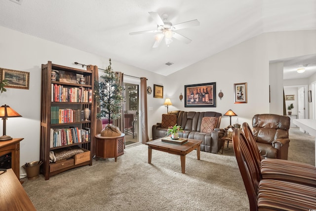 interior space featuring ceiling fan, carpet, and lofted ceiling