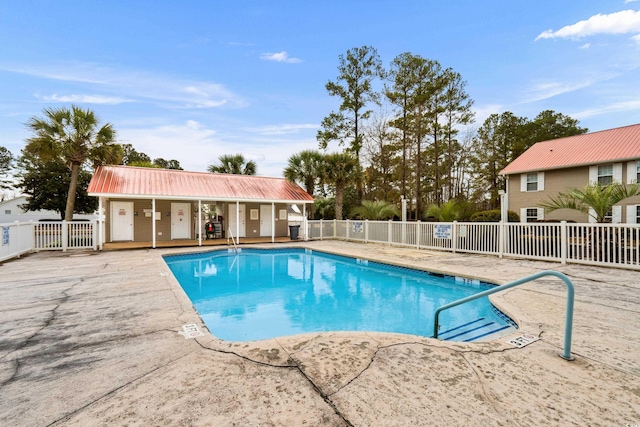 view of swimming pool with a patio area