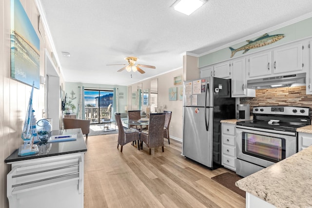 kitchen featuring ceiling fan, ornamental molding, a textured ceiling, appliances with stainless steel finishes, and white cabinetry