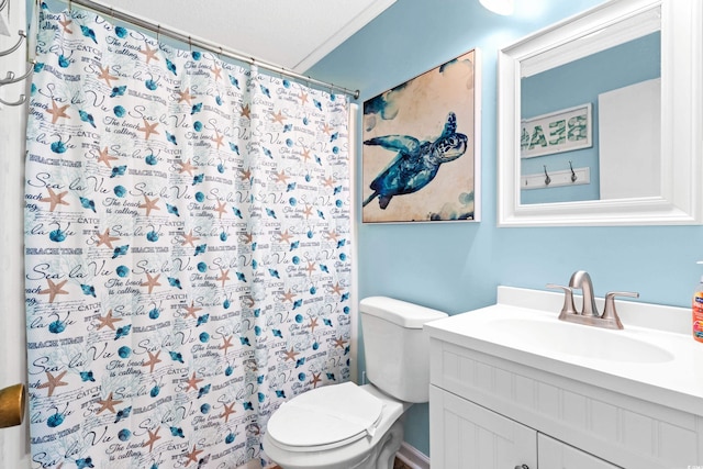 bathroom featuring vanity, toilet, walk in shower, and crown molding