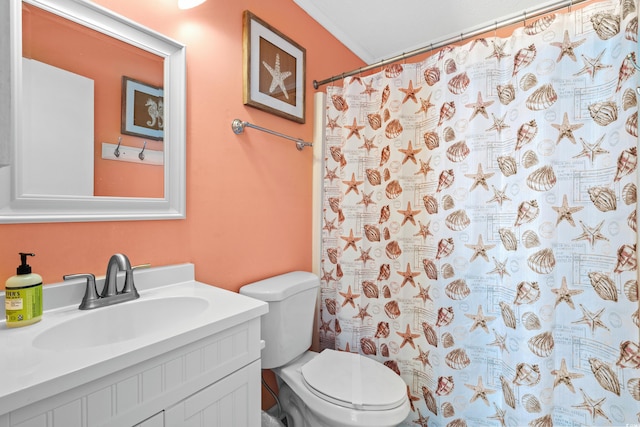 bathroom featuring a shower with curtain, vanity, toilet, and ornamental molding