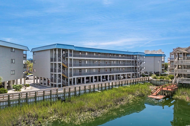 view of building exterior with a water view