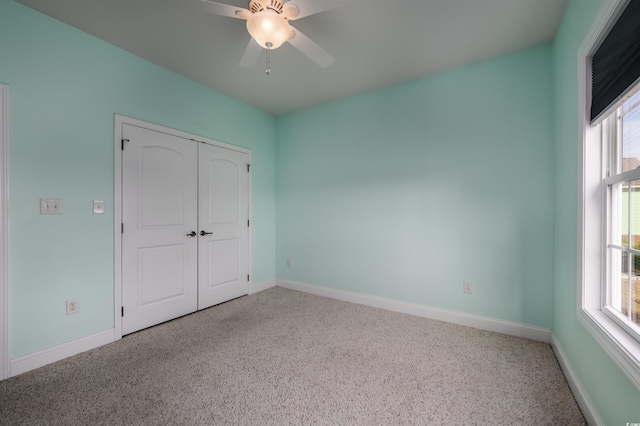 unfurnished bedroom featuring a closet and ceiling fan