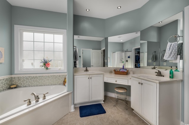 bathroom with tile patterned floors, plus walk in shower, and vanity