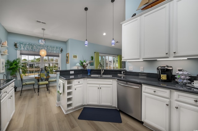 kitchen with a wealth of natural light, white cabinetry, dishwasher, hanging light fixtures, and sink