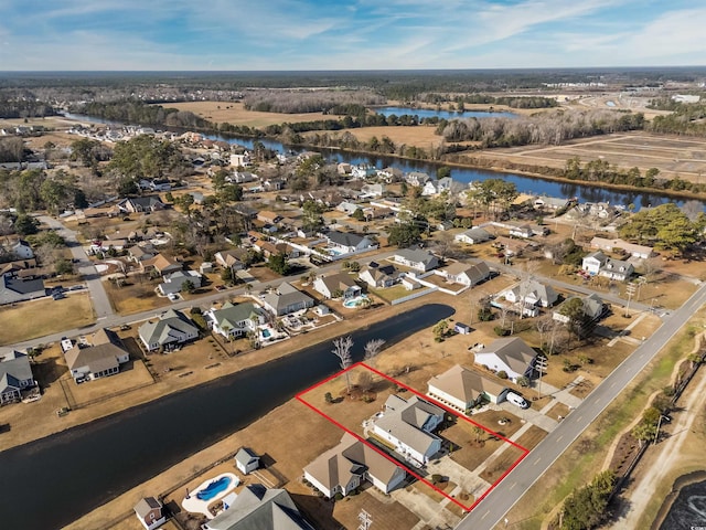 drone / aerial view with a water view