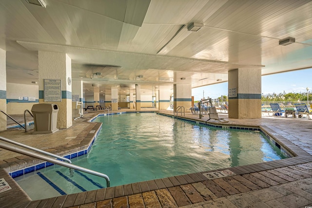 view of swimming pool with a patio area