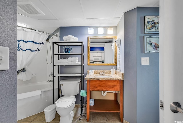 full bathroom with vanity, shower / tub combo with curtain, tile patterned floors, and toilet