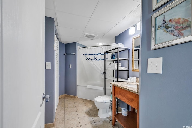 full bathroom with toilet, vanity, shower / bath combination with curtain, tile patterned flooring, and a drop ceiling